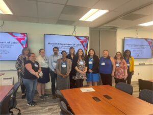 Some members of the Maryland College Testing Association stand with members of the Department of Labor at the inaugural GED Test Administrators Community of Practice meeting.